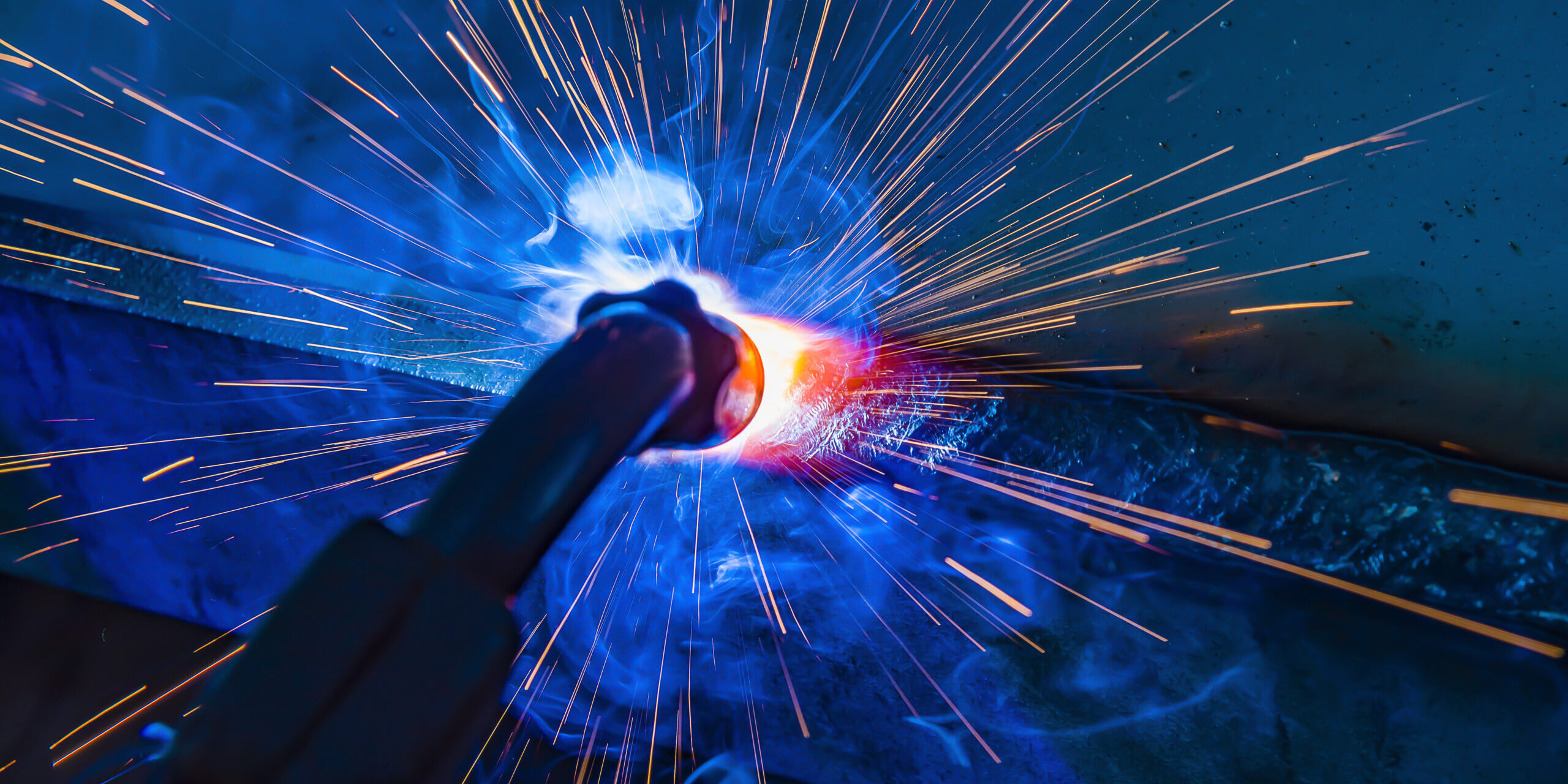 Industrial steel welder in factory