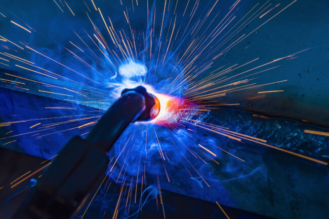Industrial steel welder in factory